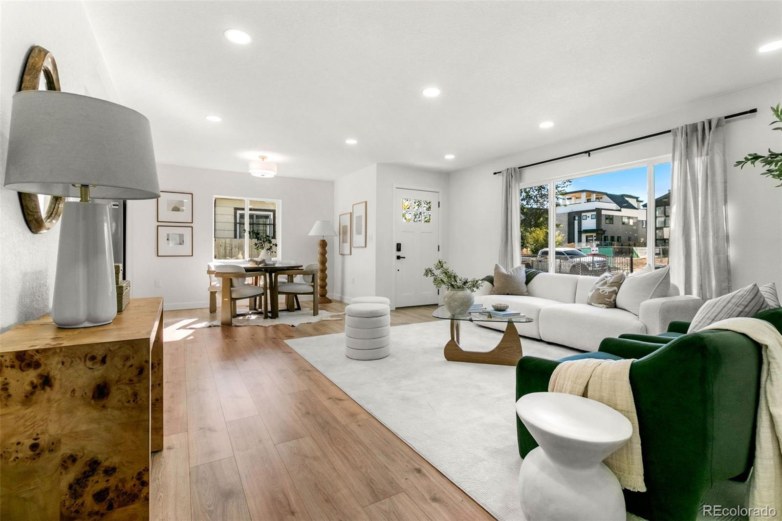 990 Tennyson Street Denver, CO 80204 - Photo 12 of 29 a living room with furniture and a flat screen tv