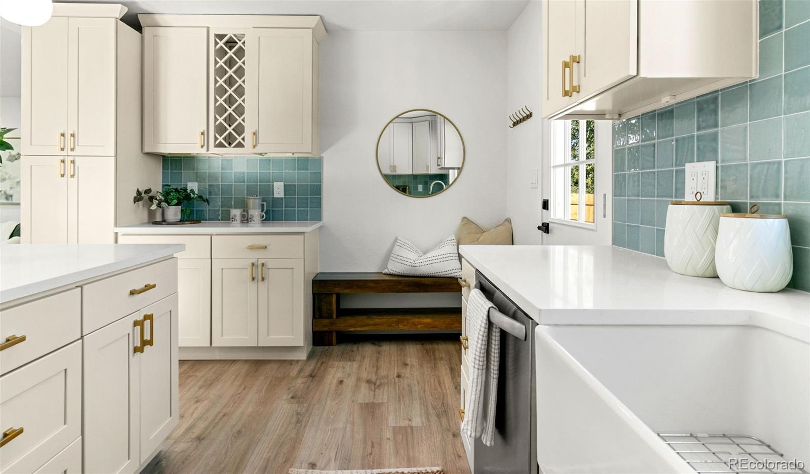 990 Tennyson Street Denver, CO 80204 - Photo 16 of 29 a bathroom with a sink and a mirror