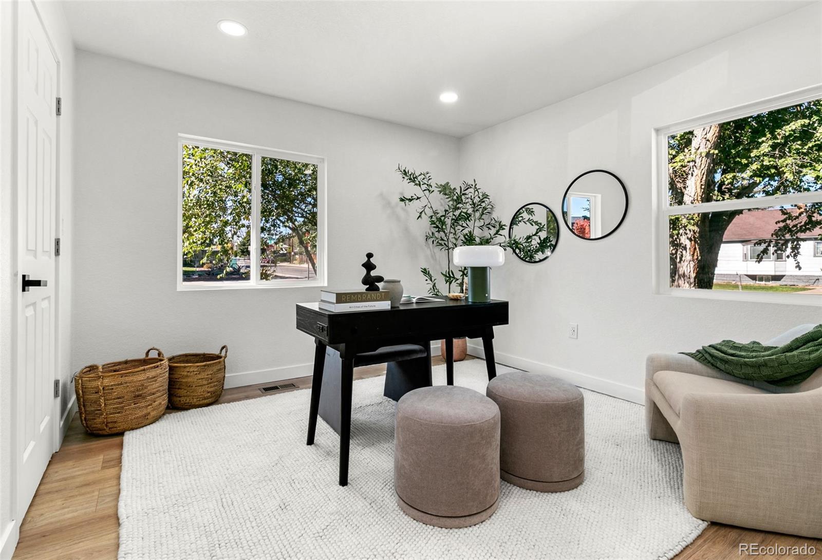 990 Tennyson Street Denver, CO 80204 - Photo 17 of 29 a bedroom with furniture and a window
