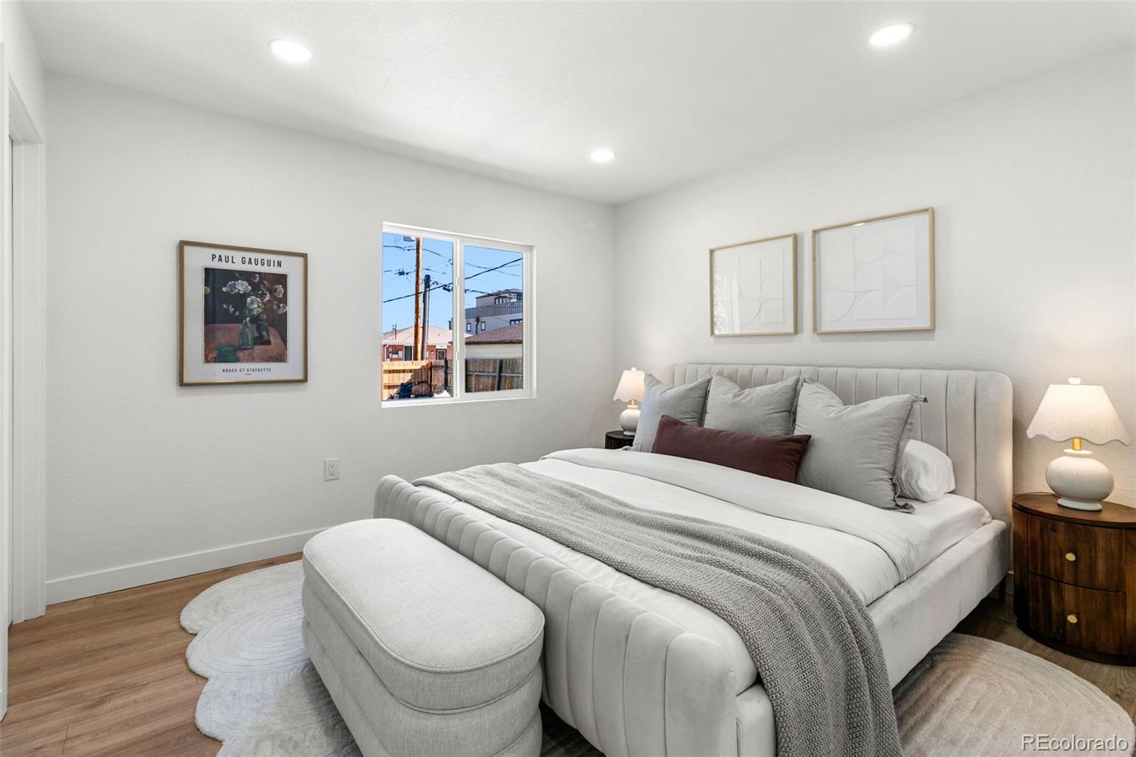 990 Tennyson Street Denver, CO 80204 - Photo 19 of 29 a bedroom with bed and a painting on the wall