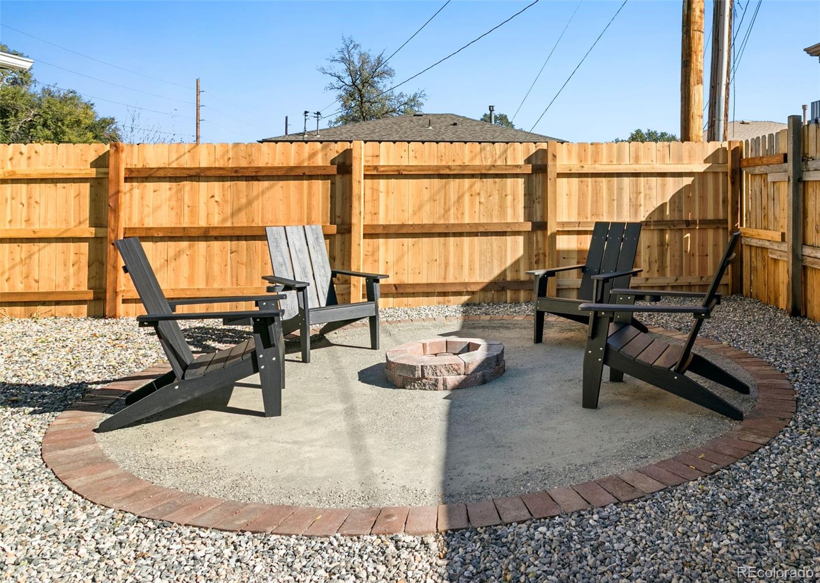 990 Tennyson Street Denver, CO 80204 - Photo 22 of 29 a dining room with furniture and a floor to ceiling window