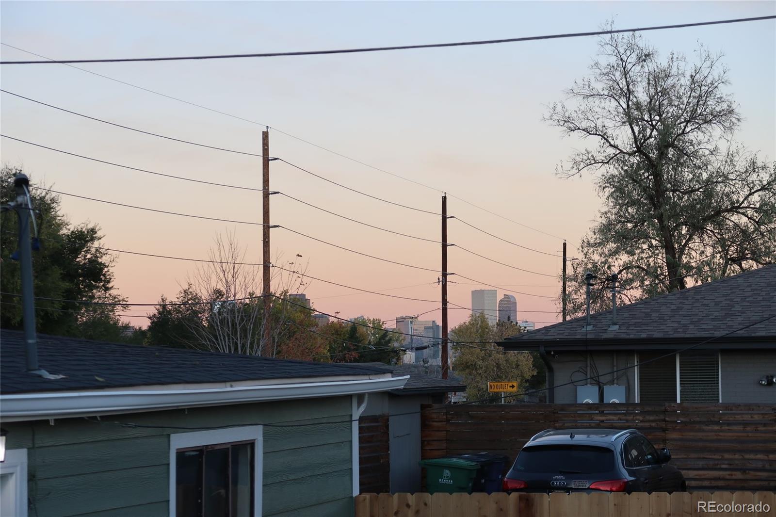 990 Tennyson Street Denver, CO 80204 - Photo 25 of 29 a front view of a house with garden