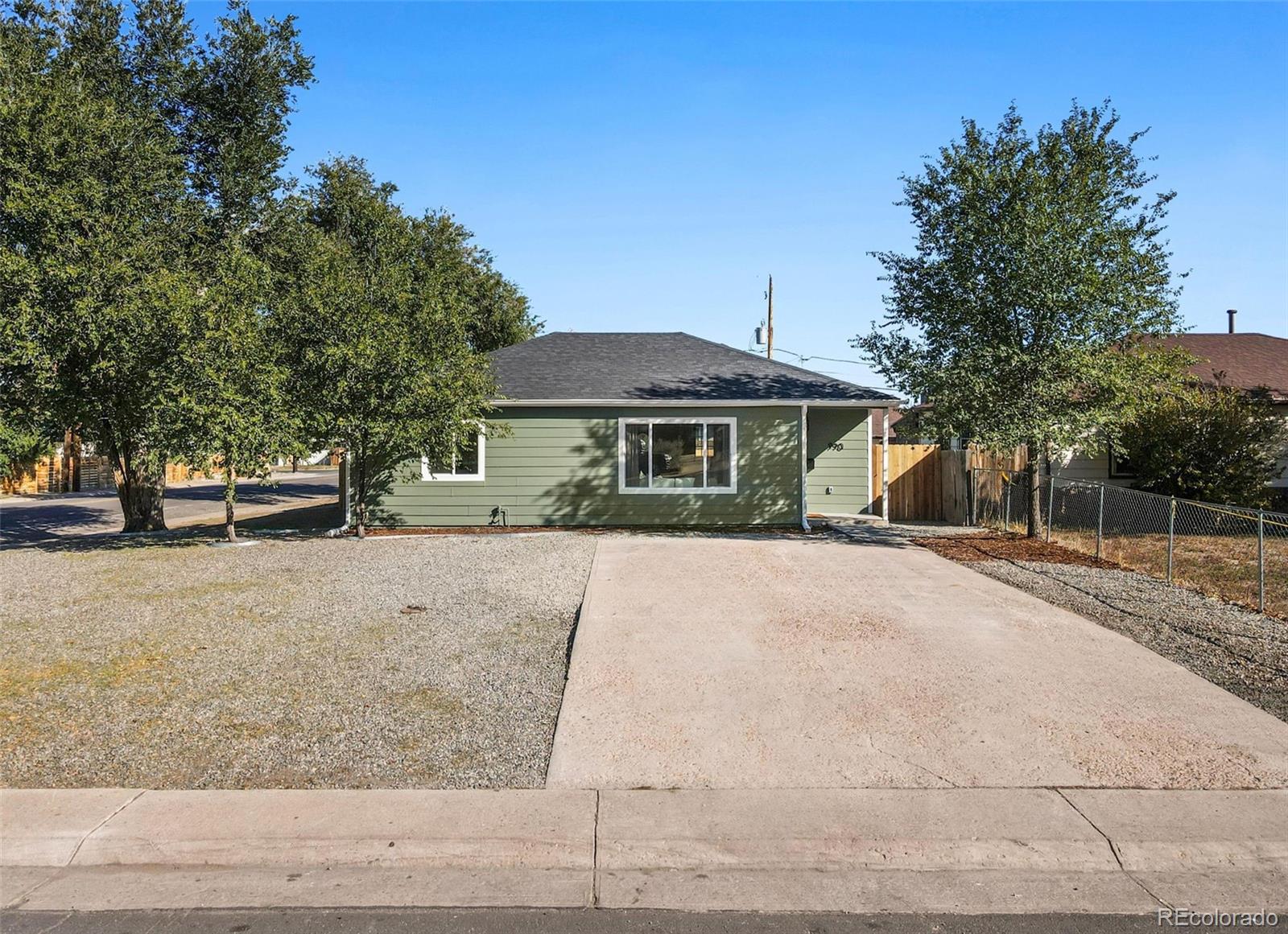 990 Tennyson Street Denver, CO 80204 - Photo 29 of 29 a front view of a house with a yard