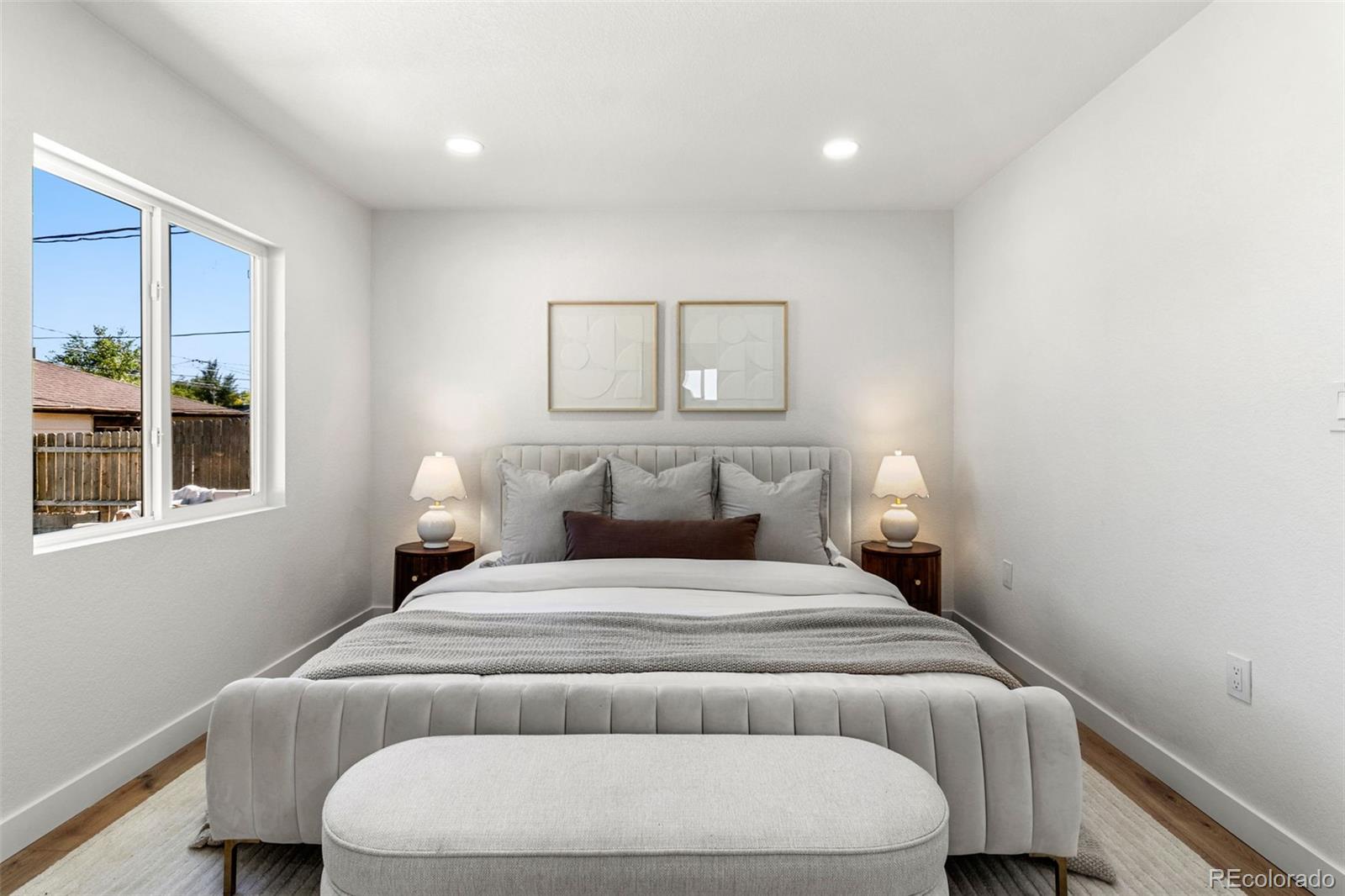 990 Tennyson Street Denver, CO 80204 - Photo 6 of 29 a bedroom with a bed and a window