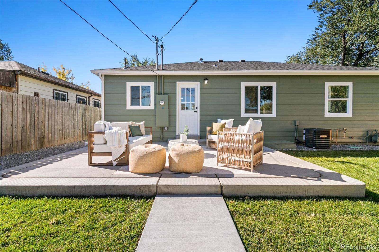 990 Tennyson Street Denver, CO 80204 - Photo 8 of 29 a view of a house with backyard sitting area and garden