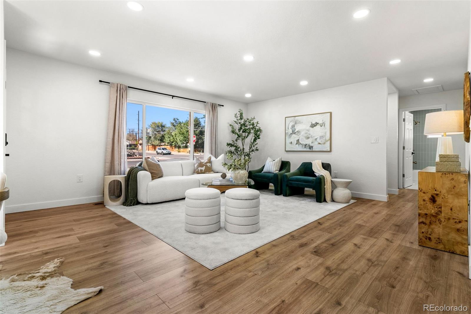 990 Tennyson Street Denver, CO 80204 - Photo 10 of 29 a living room with furniture and a large window