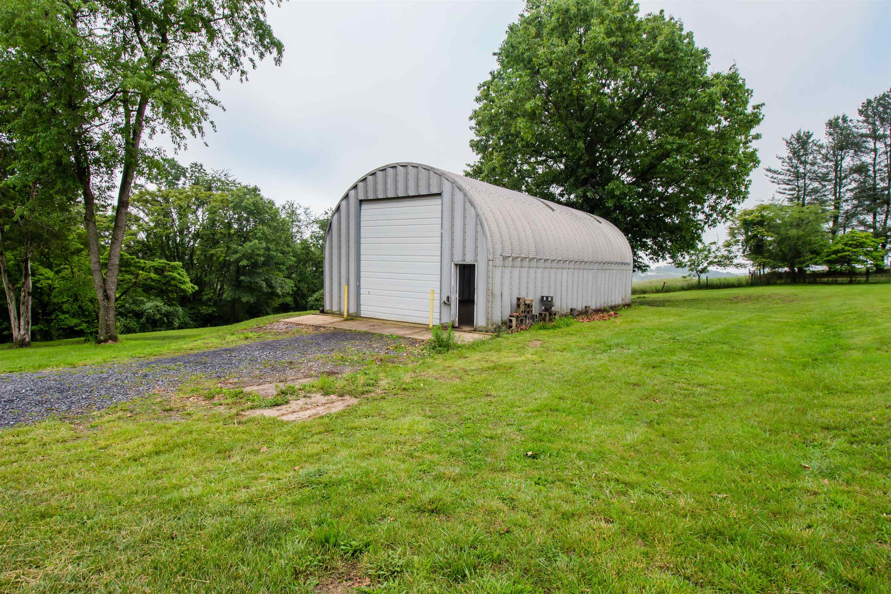 7377 Apple Ridge Drive Timberville, VA 22853 - Photo 26 of 45 a view of a tiny house with a yard and large trees
