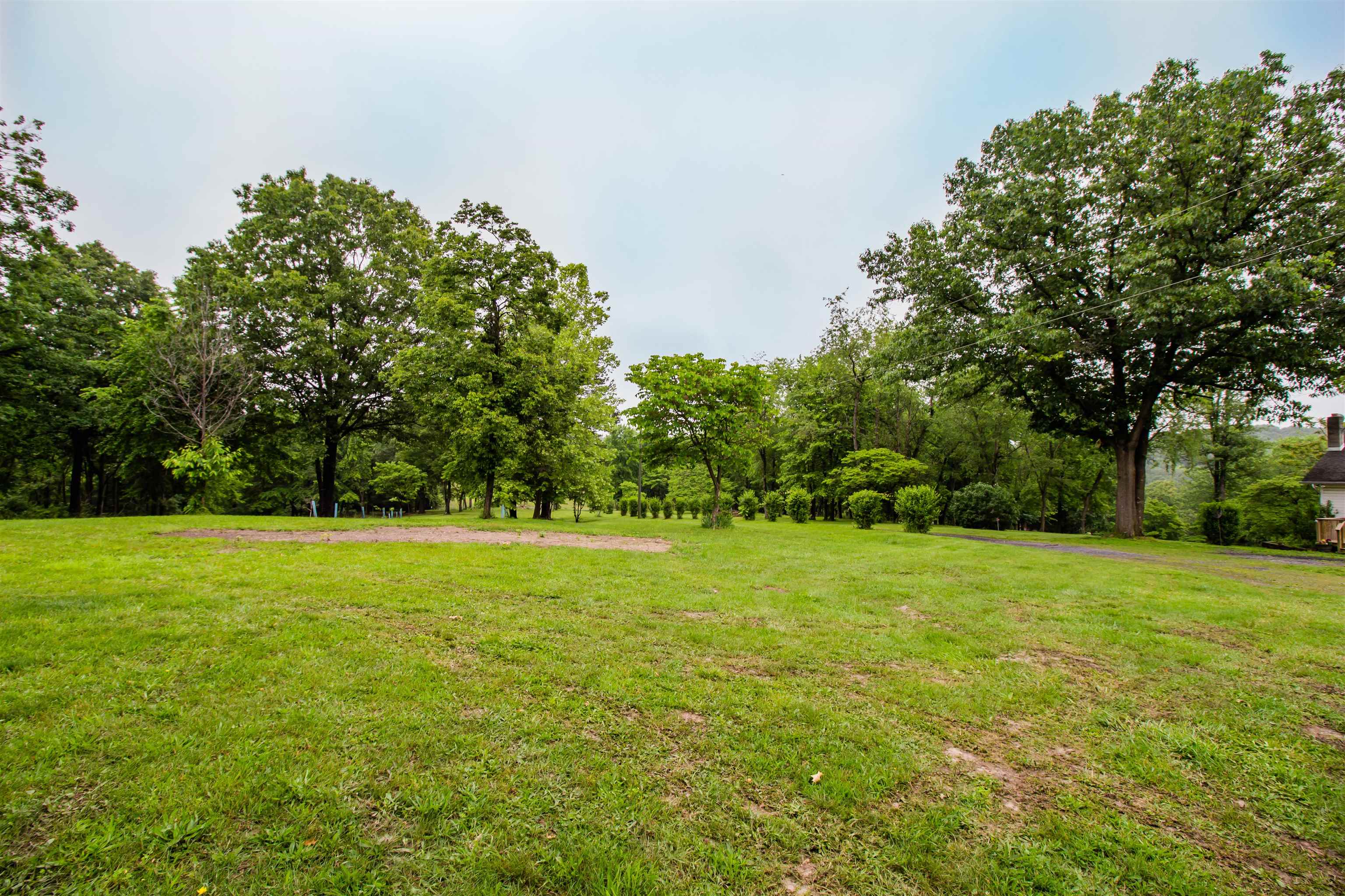7377 Apple Ridge Drive Timberville, VA 22853 - Photo 28 of 45 a view of a field with trees in front of it