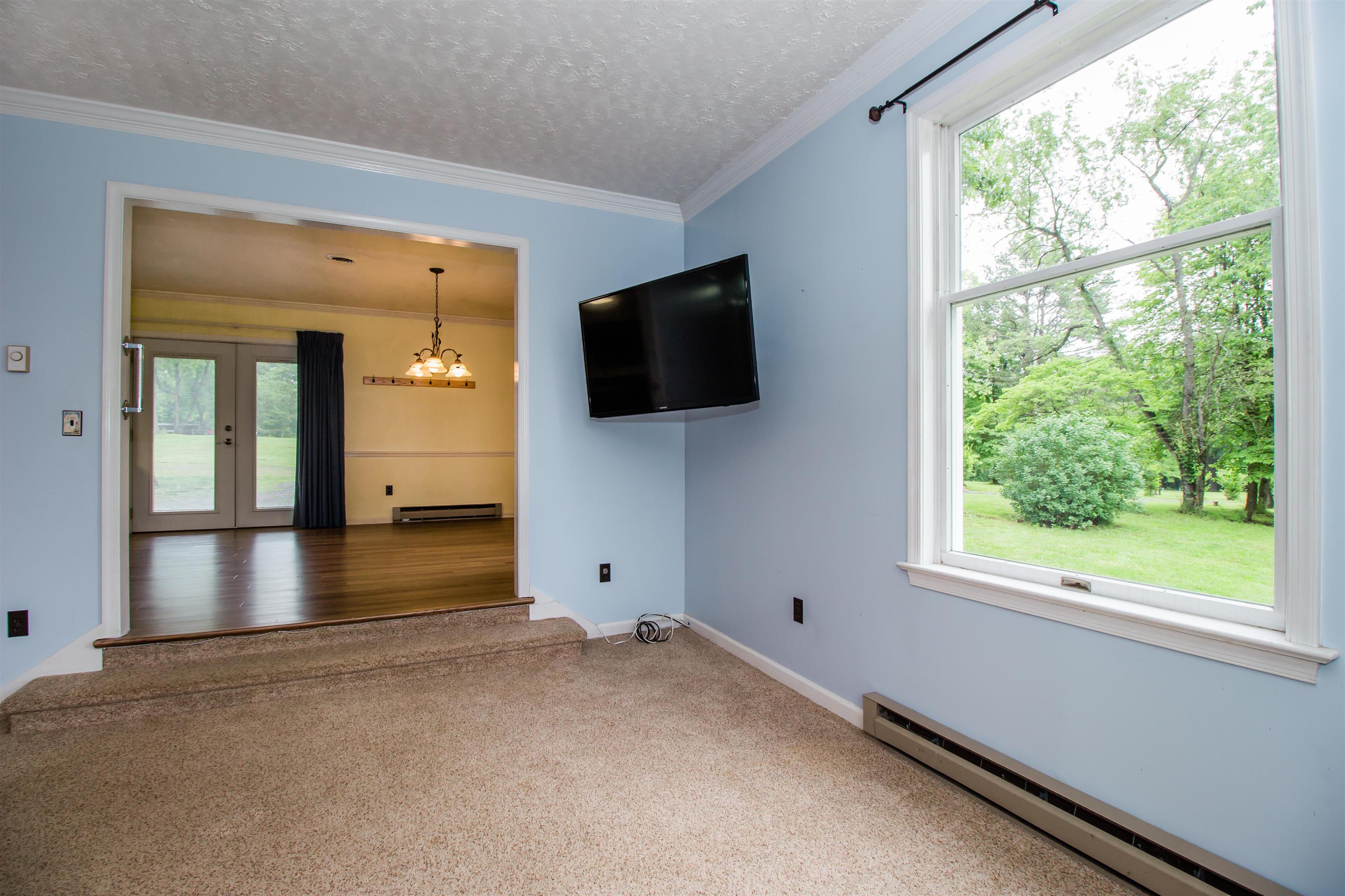 7377 Apple Ridge Drive Timberville, VA 22853 - Photo 9 of 45 a view of a livingroom with a flat screen tv