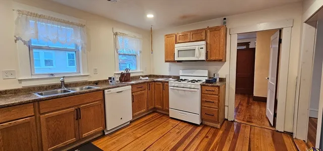 a kitchen with sink cabinets and window