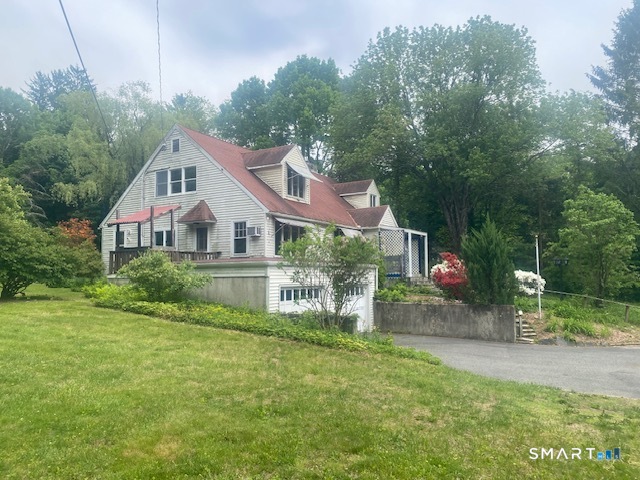 33 Flanders Road Bethlehem, CT 06751 - Photo 2 of 18 a front view of house with yard and green space