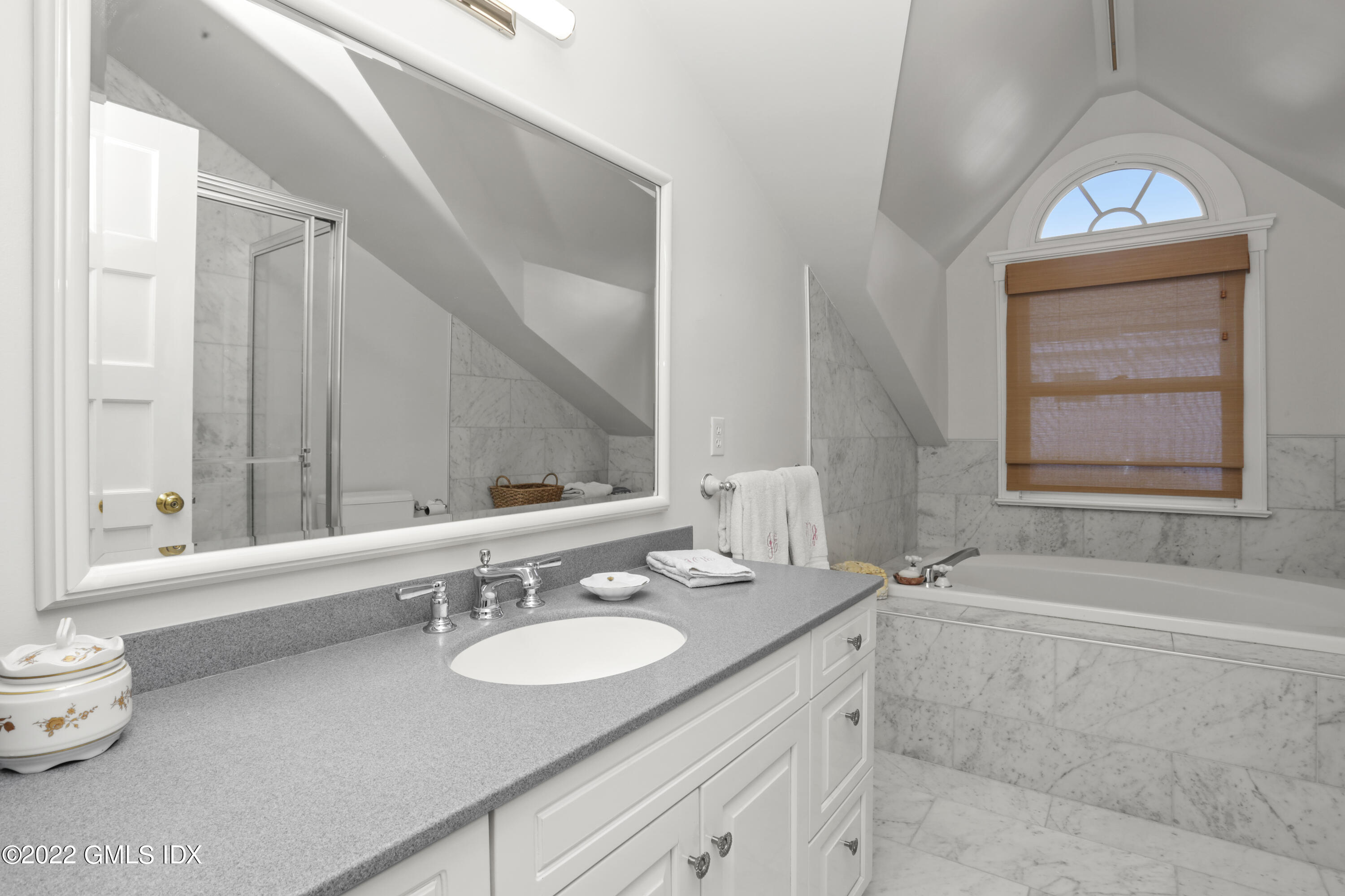 12 Maher Avenue Greenwich, CT 06830 - Photo 14 of 34 a bathroom with a sink and a mirror