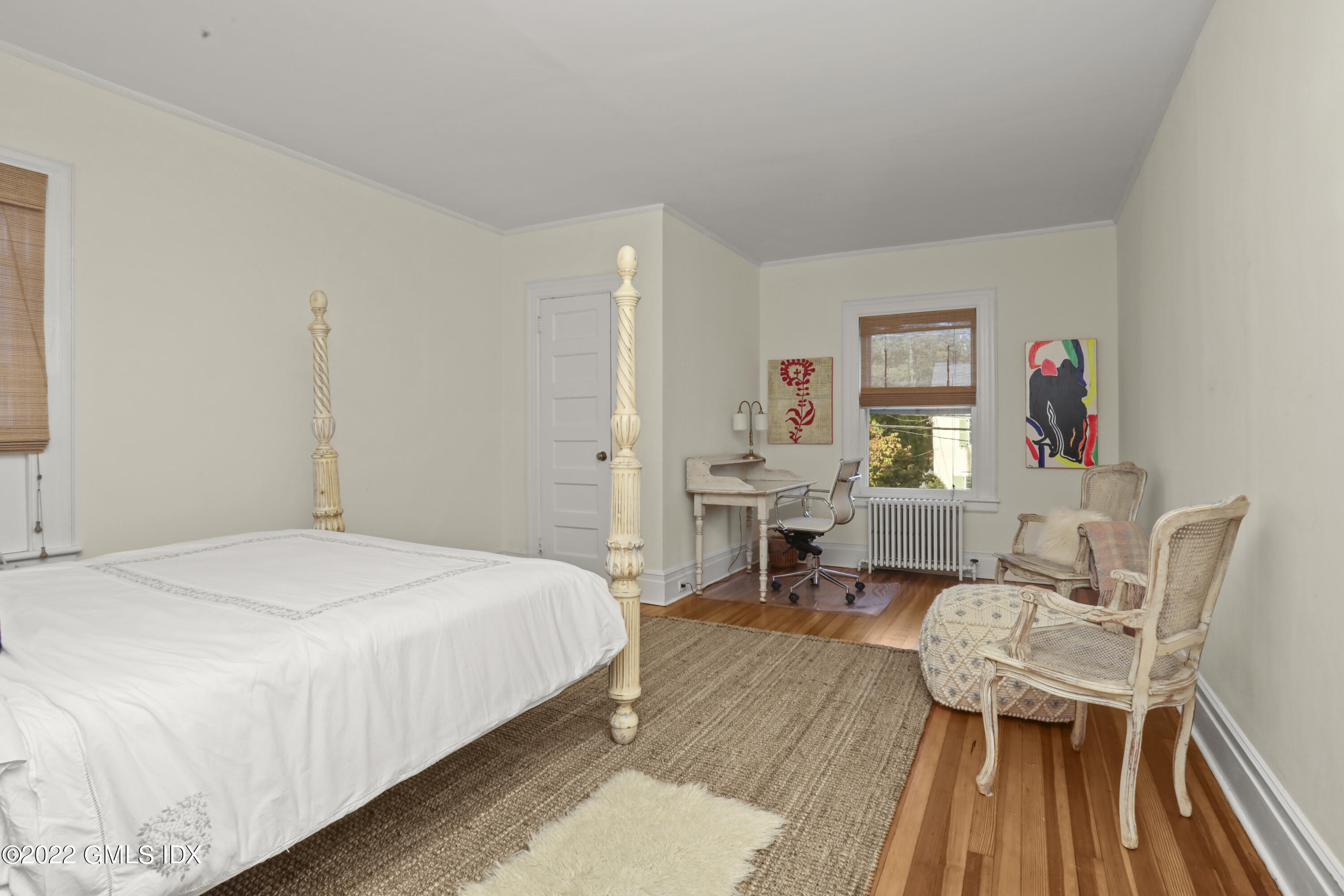 12 Maher Avenue Greenwich, CT 06830 - Photo 16 of 34 a bedroom with a bed and a table