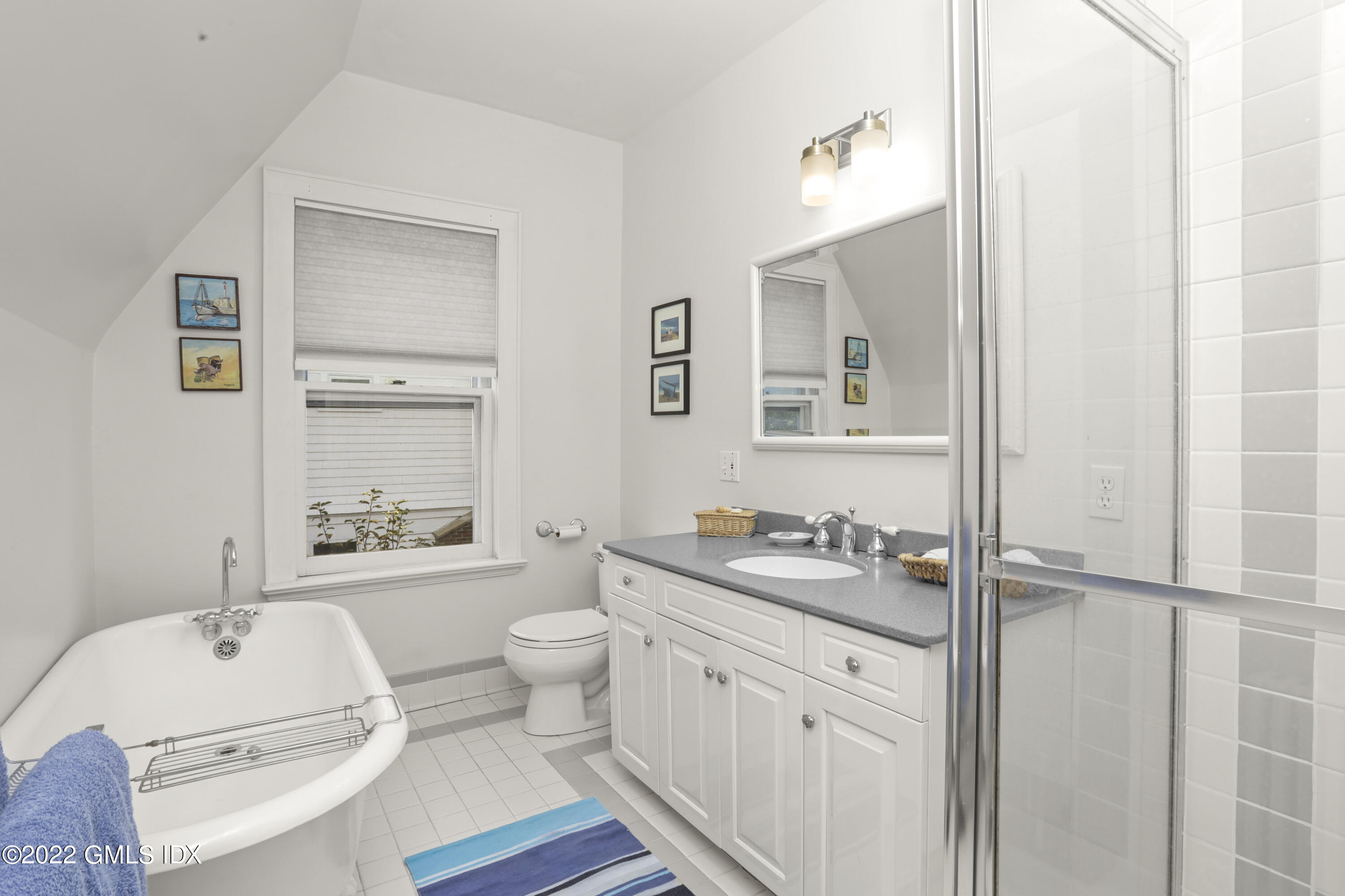 12 Maher Avenue Greenwich, CT 06830 - Photo 17 of 34 a bathroom with a granite countertop sink mirror vanity bathtub and a toilet