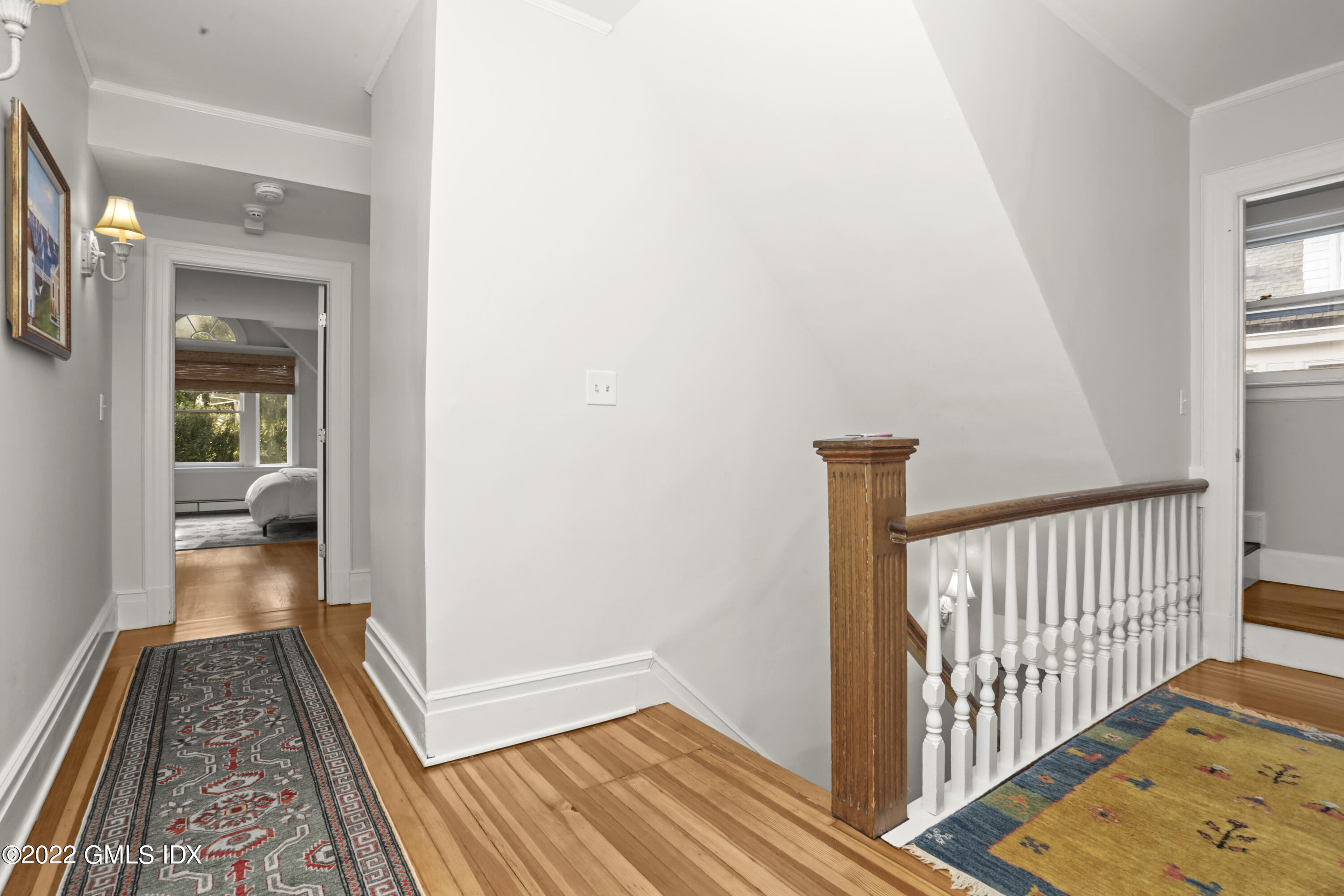 12 Maher Avenue Greenwich, CT 06830 - Photo 18 of 34 a view of hallway with wooden floor and a rug