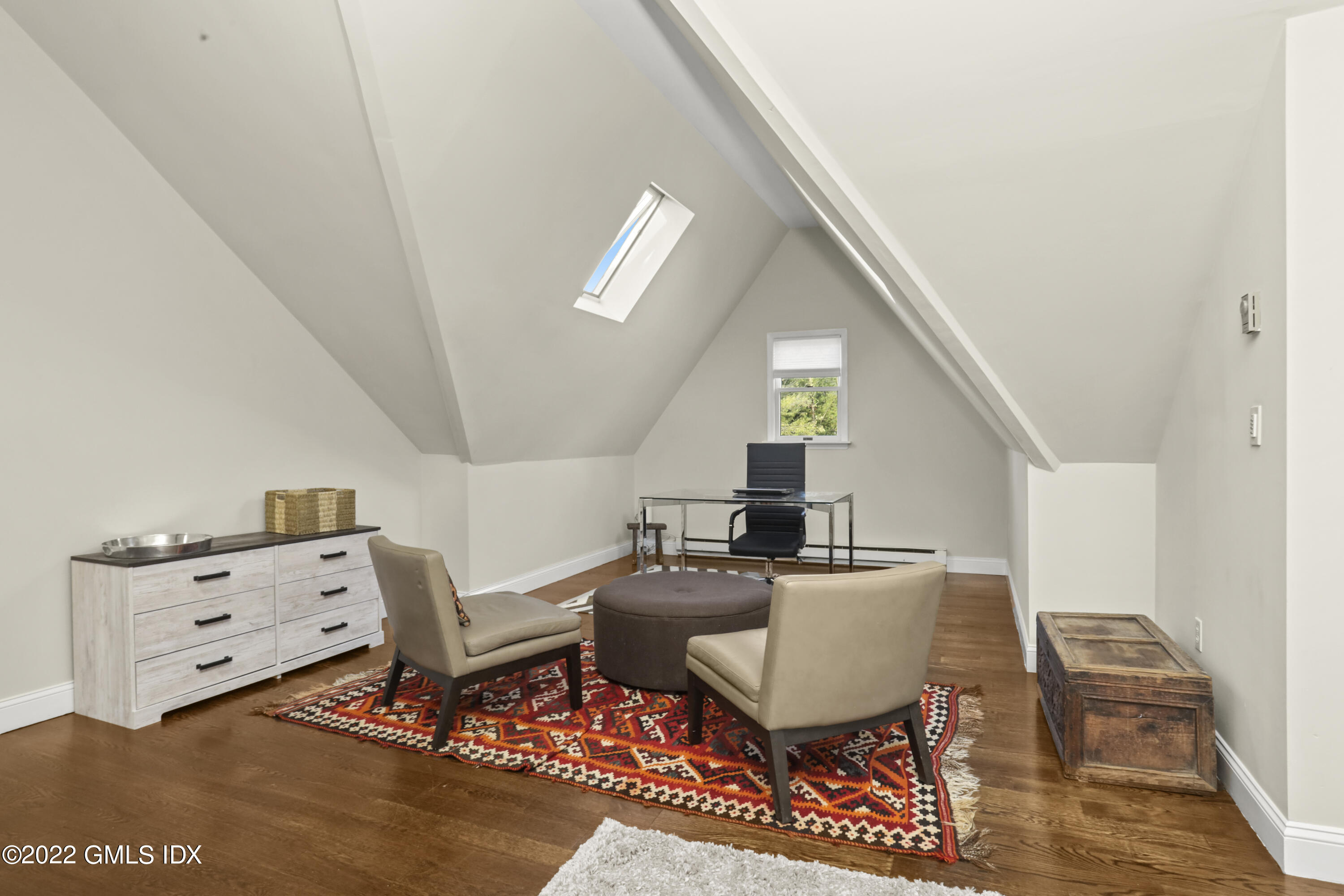 12 Maher Avenue Greenwich, CT 06830 - Photo 19 of 34 a living room with furniture and a baby crib