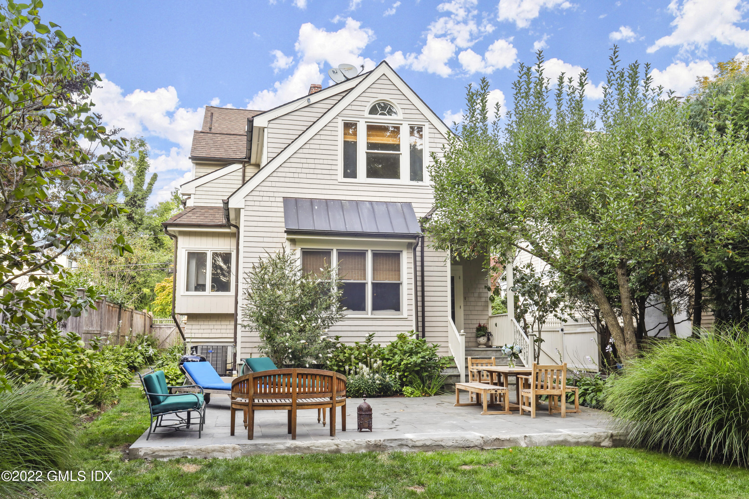 12 Maher Avenue Greenwich, CT 06830 - Photo 23 of 34 a front view of a house with garden