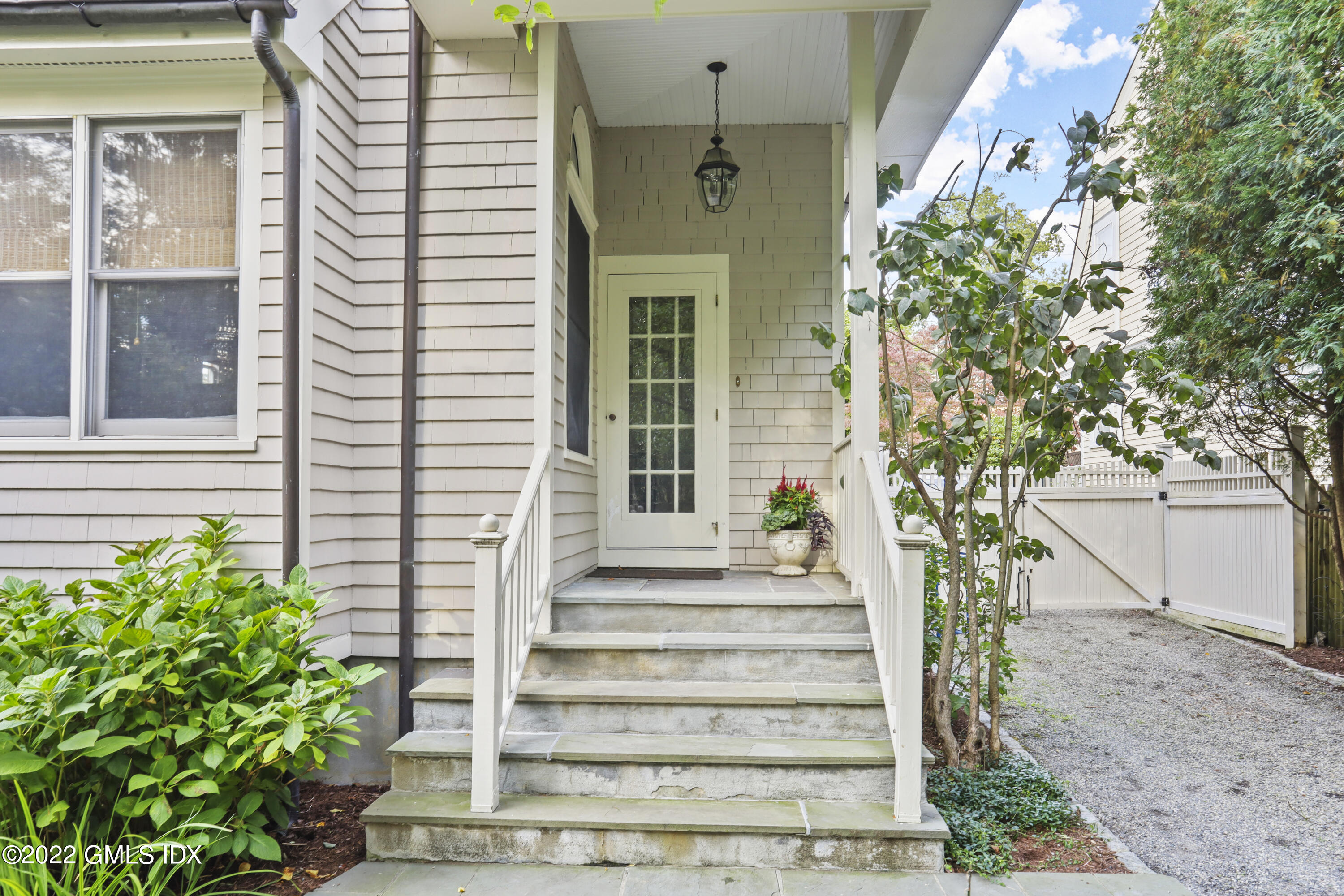 12 Maher Avenue Greenwich, CT 06830 - Photo 27 of 34 a front view of a house with a garden