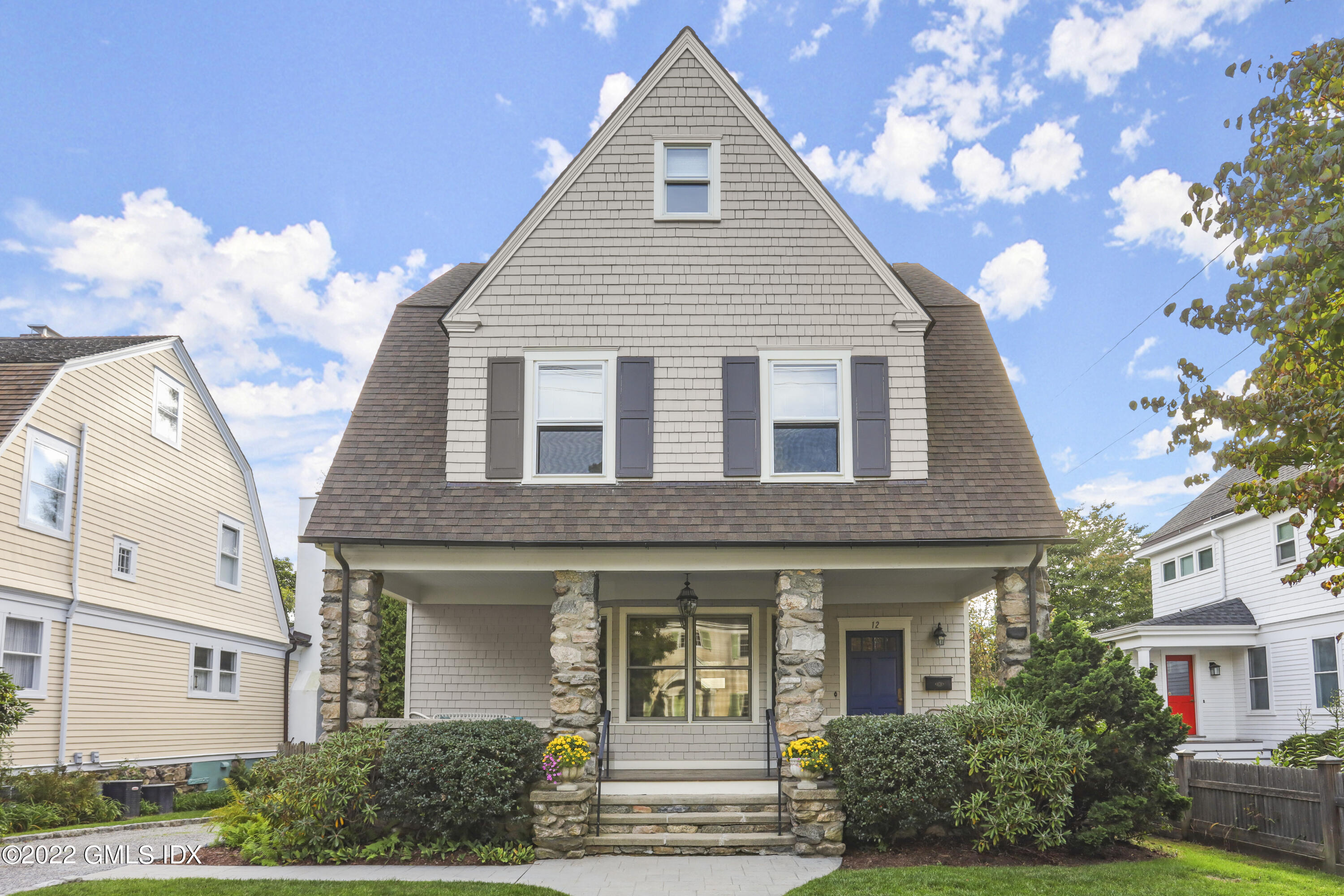12 Maher Avenue Greenwich, CT 06830 - Photo 30 of 34 a front view of a house with garden