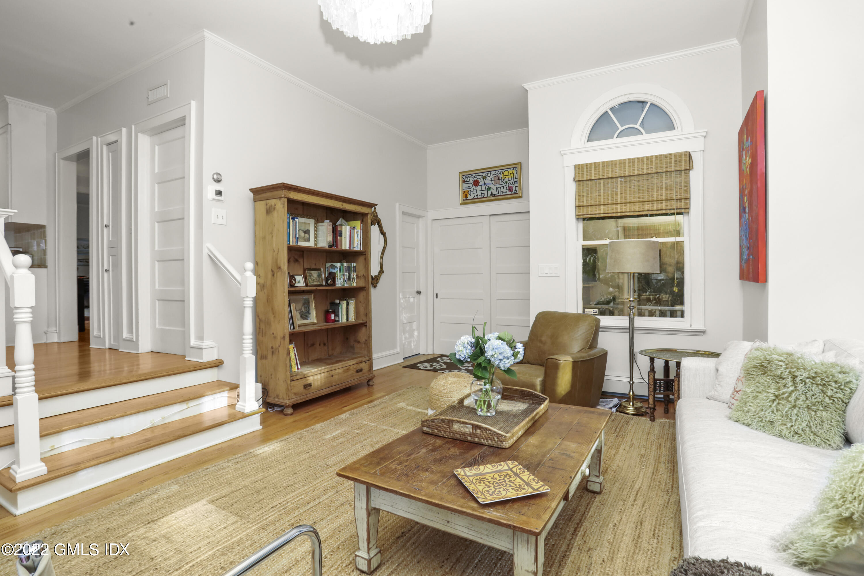 12 Maher Avenue Greenwich, CT 06830 - Photo 10 of 34 a living room with furniture a rug and a large window