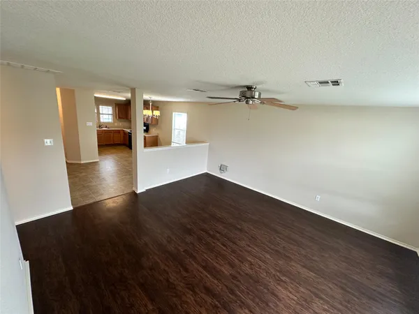 a view of a livingroom with wooden floor