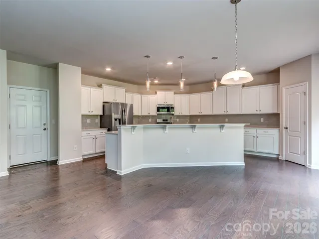 a view of kitchen with wooden floor