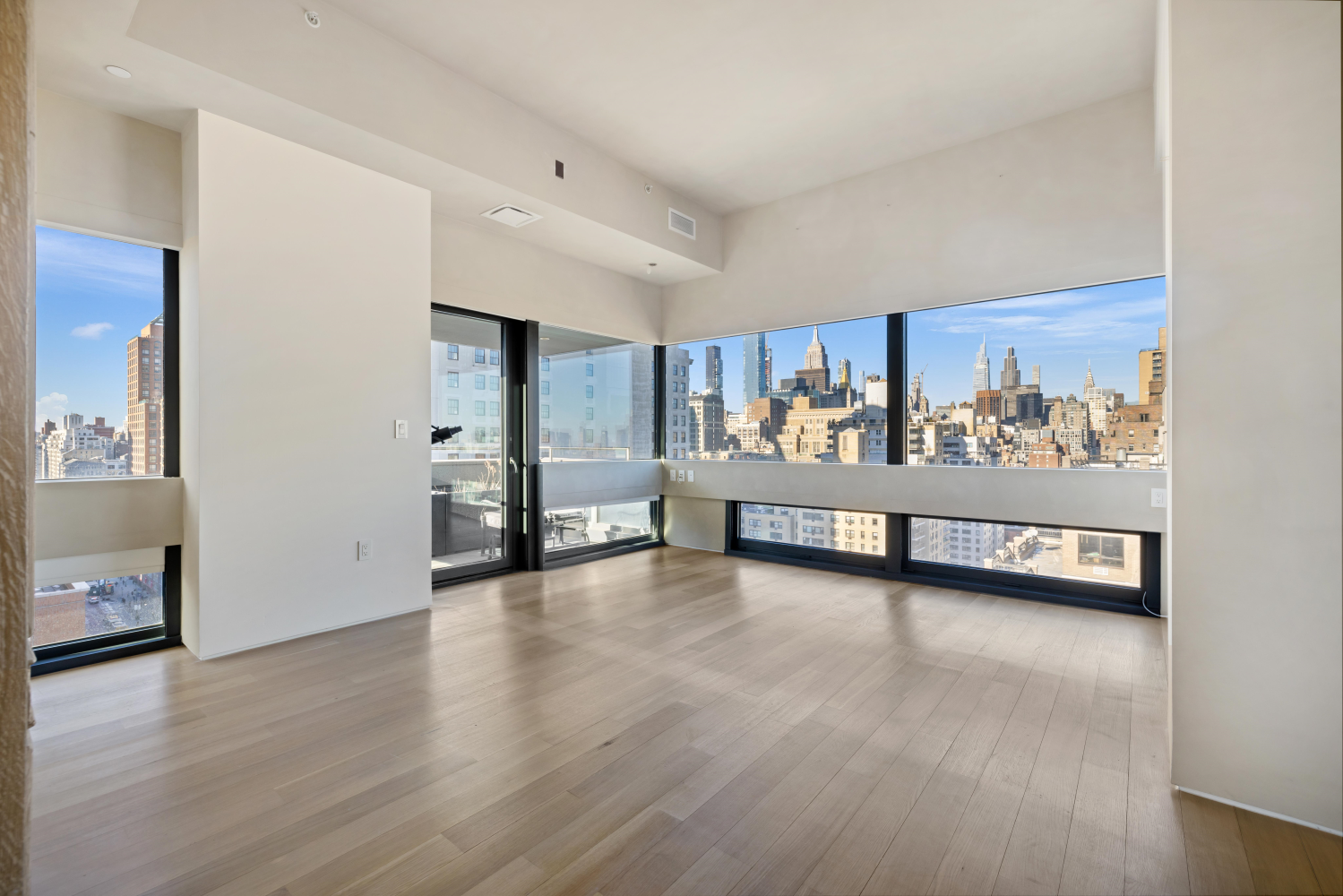 123 3rd Avenue, Unit 15A Manhattan, NY 10003 - Photo 12 of 27 a view of a big room with wooden floor and windows