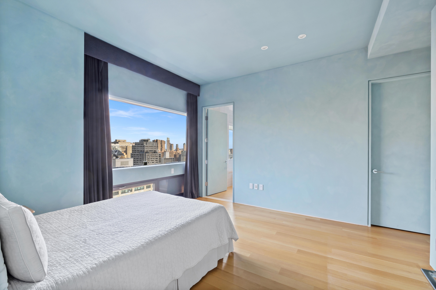 123 3rd Avenue, Unit 15A Manhattan, NY 10003 - Photo 18 of 27 a bedroom with a bed and a window
