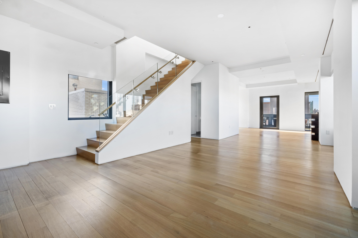 123 3rd Avenue, Unit 15A Manhattan, NY 10003 - Photo 2 of 27 a view of a room with wooden floor and stairs