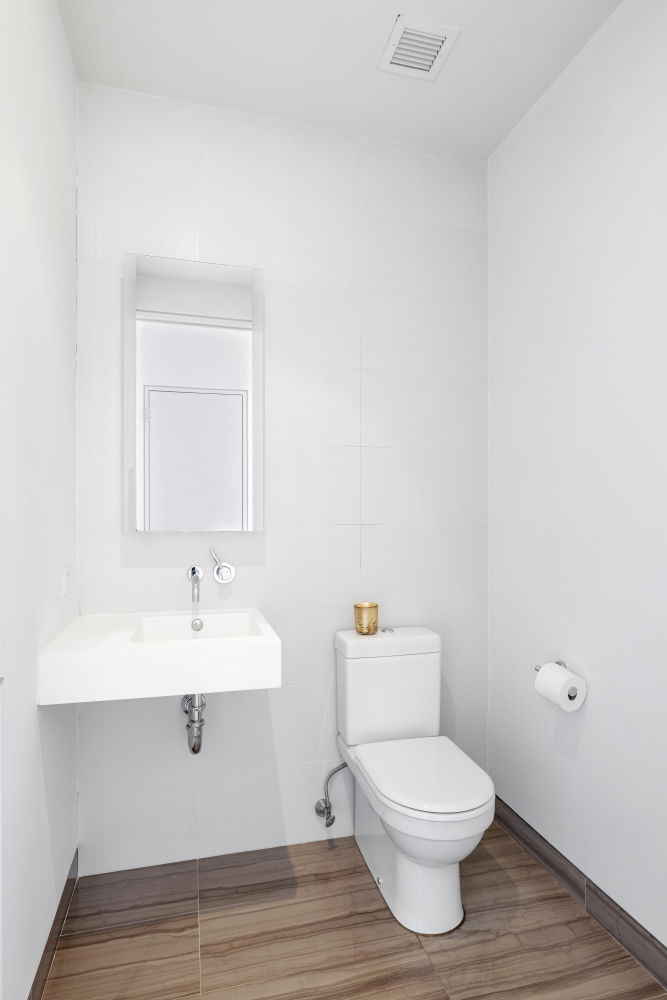 123 3rd Avenue, Unit 15A Manhattan, NY 10003 - Photo 6 of 27 a bathroom with a toilet a sink and mirror