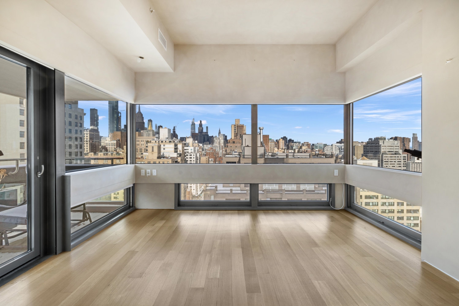 123 3rd Avenue, Unit 15A Manhattan, NY 10003 - Photo 10 of 27 a view of a living room with a large window