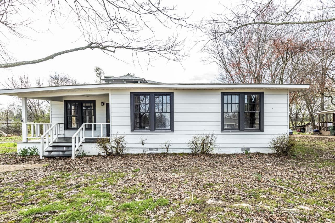 4615 Highway 54 Covington, TN 38019 - Photo 1 of 24 a front view of a house with garden