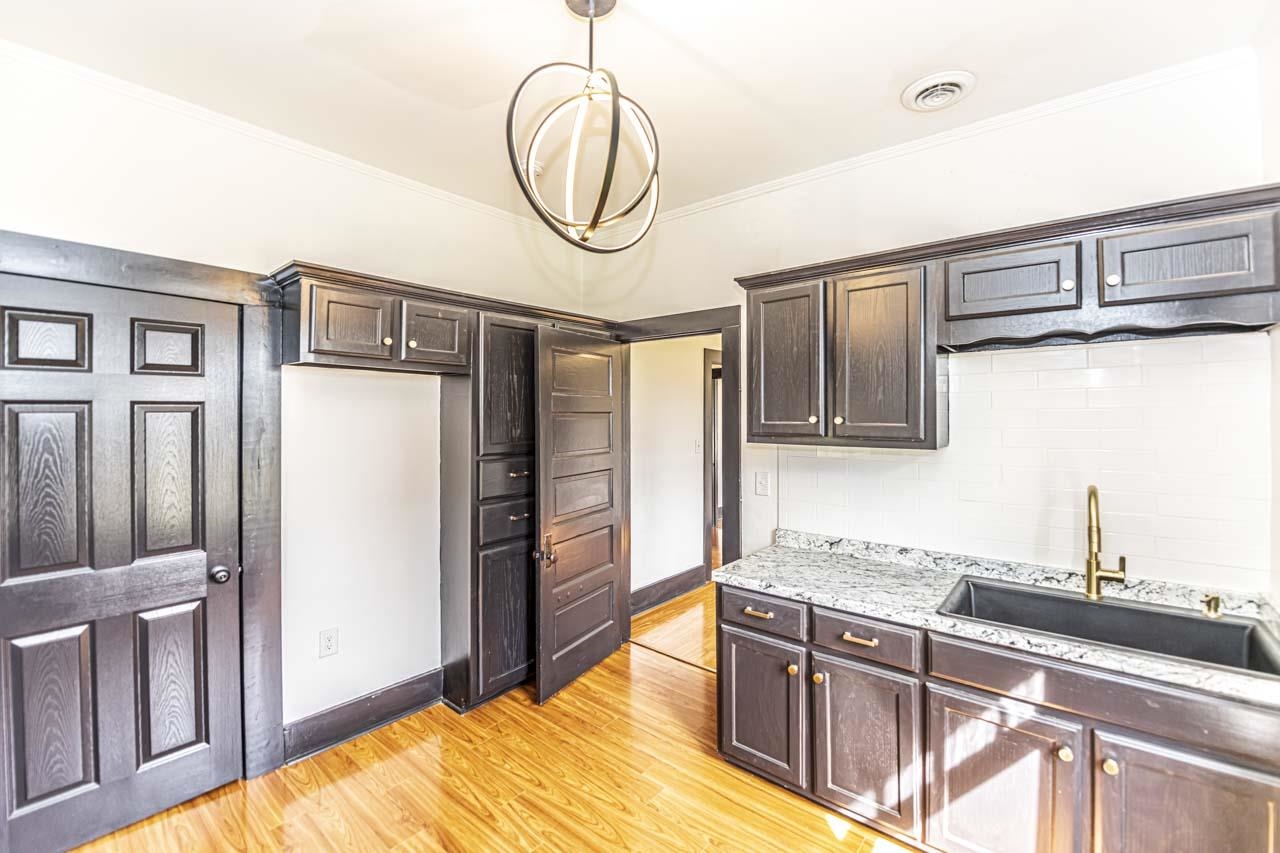 4615 Highway 54 Covington, TN 38019 - Photo 18 of 24 a kitchen with stainless steel appliances granite countertop a refrigerator and a sink