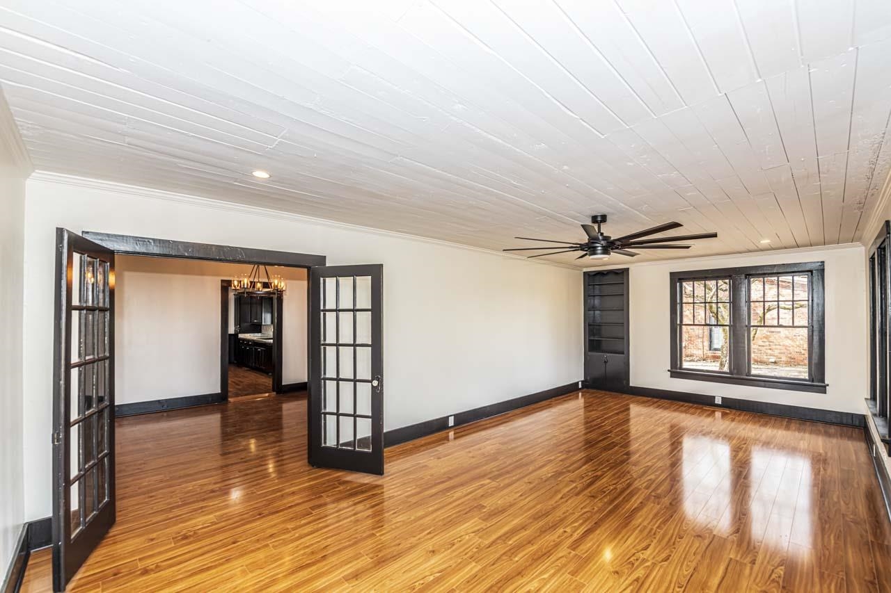4615 Highway 54 Covington, TN 38019 - Photo 4 of 24 wooden floor in an empty room with a window
