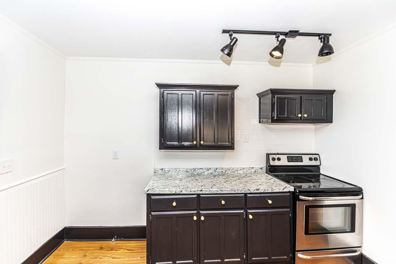 4615 Highway 54 Covington, TN 38019 - Photo 9 of 24 a kitchen with a stove and a microwave