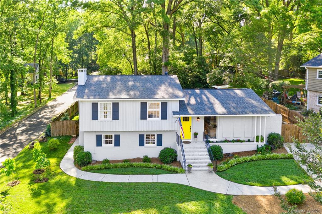 7026 Morganford Road Charlotte, NC 28211 - Photo 2 of 35 a aerial view of a house next to a yard