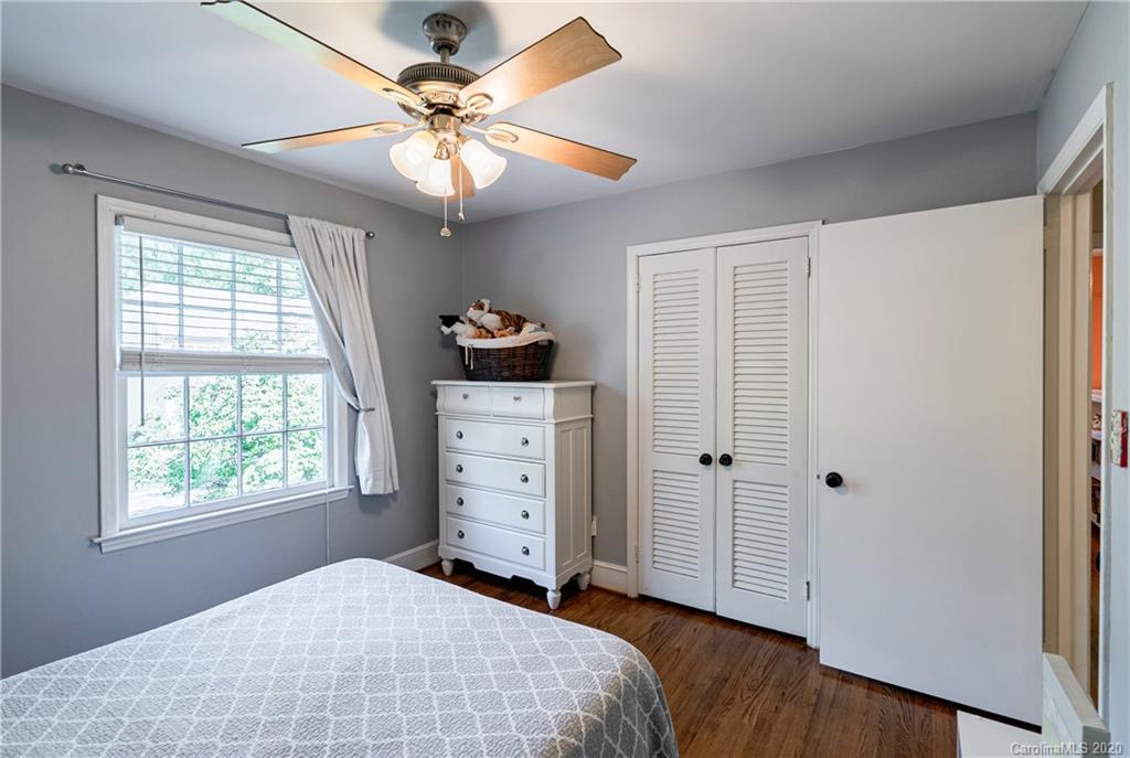 7026 Morganford Road Charlotte, NC 28211 - Photo 12 of 35 a bedroom with a bed and a window