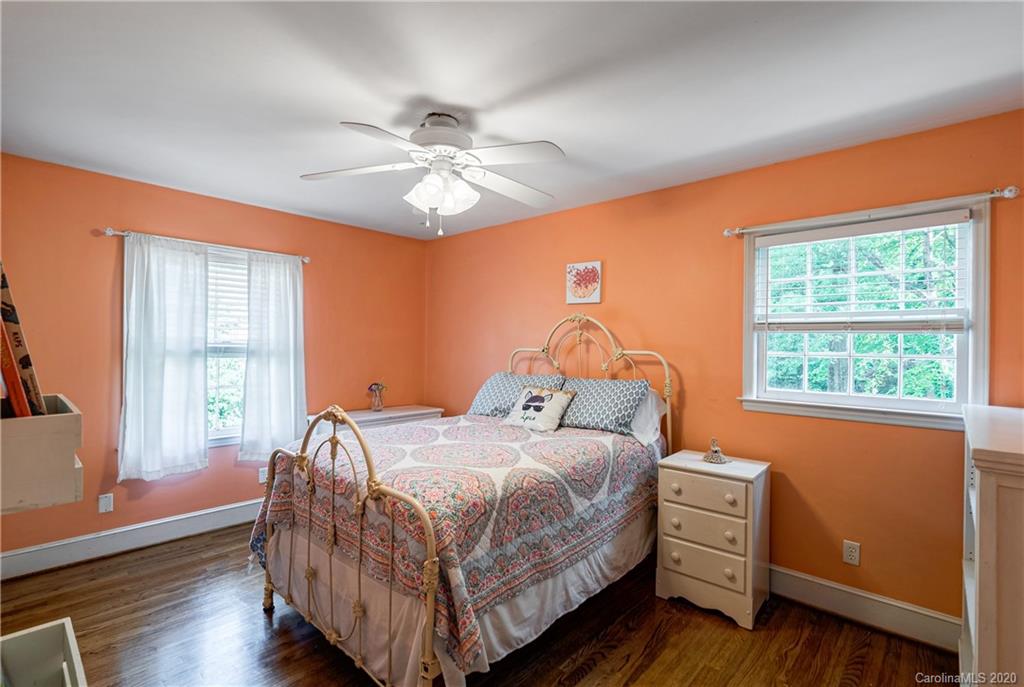 7026 Morganford Road Charlotte, NC 28211 - Photo 13 of 35 a bedroom with a bed and a window
