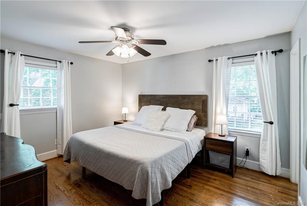 7026 Morganford Road Charlotte, NC 28211 - Photo 14 of 35 a bedroom with a bed and a window