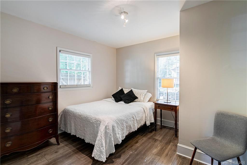 7026 Morganford Road Charlotte, NC 28211 - Photo 23 of 35 a bedroom with a bed and a window