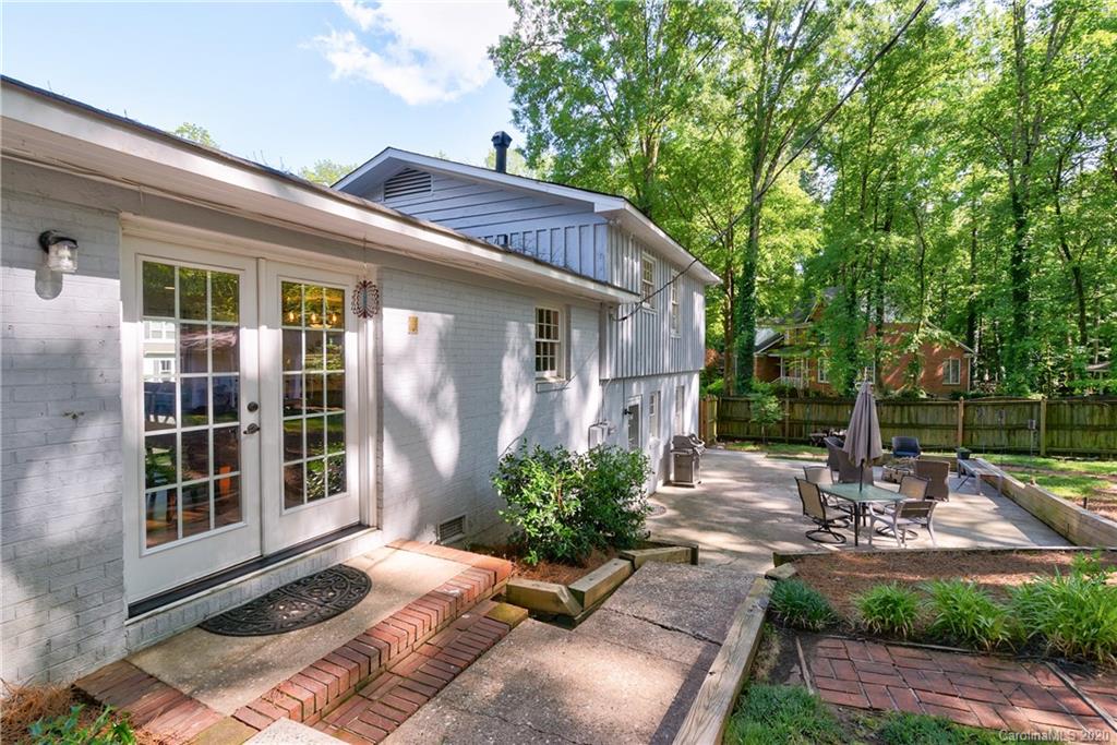 7026 Morganford Road Charlotte, NC 28211 - Photo 26 of 35 a view of a house with backyard and sitting area