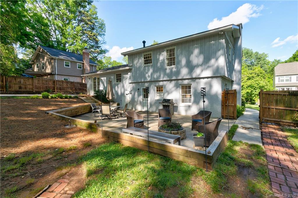 7026 Morganford Road Charlotte, NC 28211 - Photo 33 of 35 a view of pool with lawn chairs and floor to ceiling window