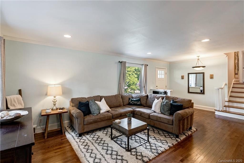 7026 Morganford Road Charlotte, NC 28211 - Photo 7 of 35 a living room with furniture and a wooden floor