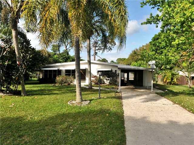 7304 James Road Fort Pierce, FL 34951 - Photo 1 of 1 a view of a house with a yard and tree s