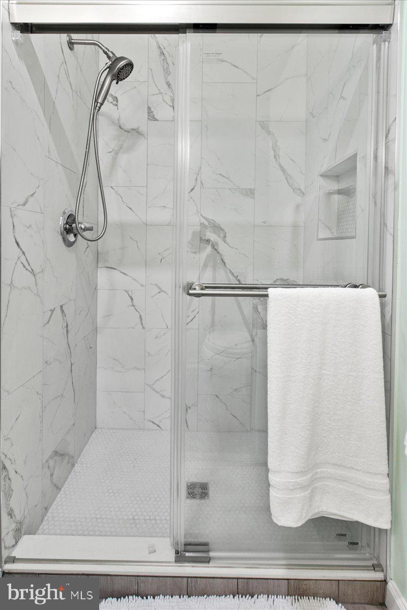 7128 Devonshire Road Alexandria, VA 22307 - Photo 23 of 36 a bathroom with a shower