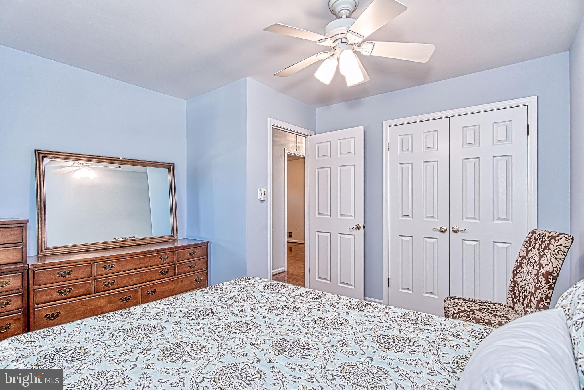 7128 Devonshire Road Alexandria, VA 22307 - Photo 24 of 36 a bedroom with a bed and a flat screen tv