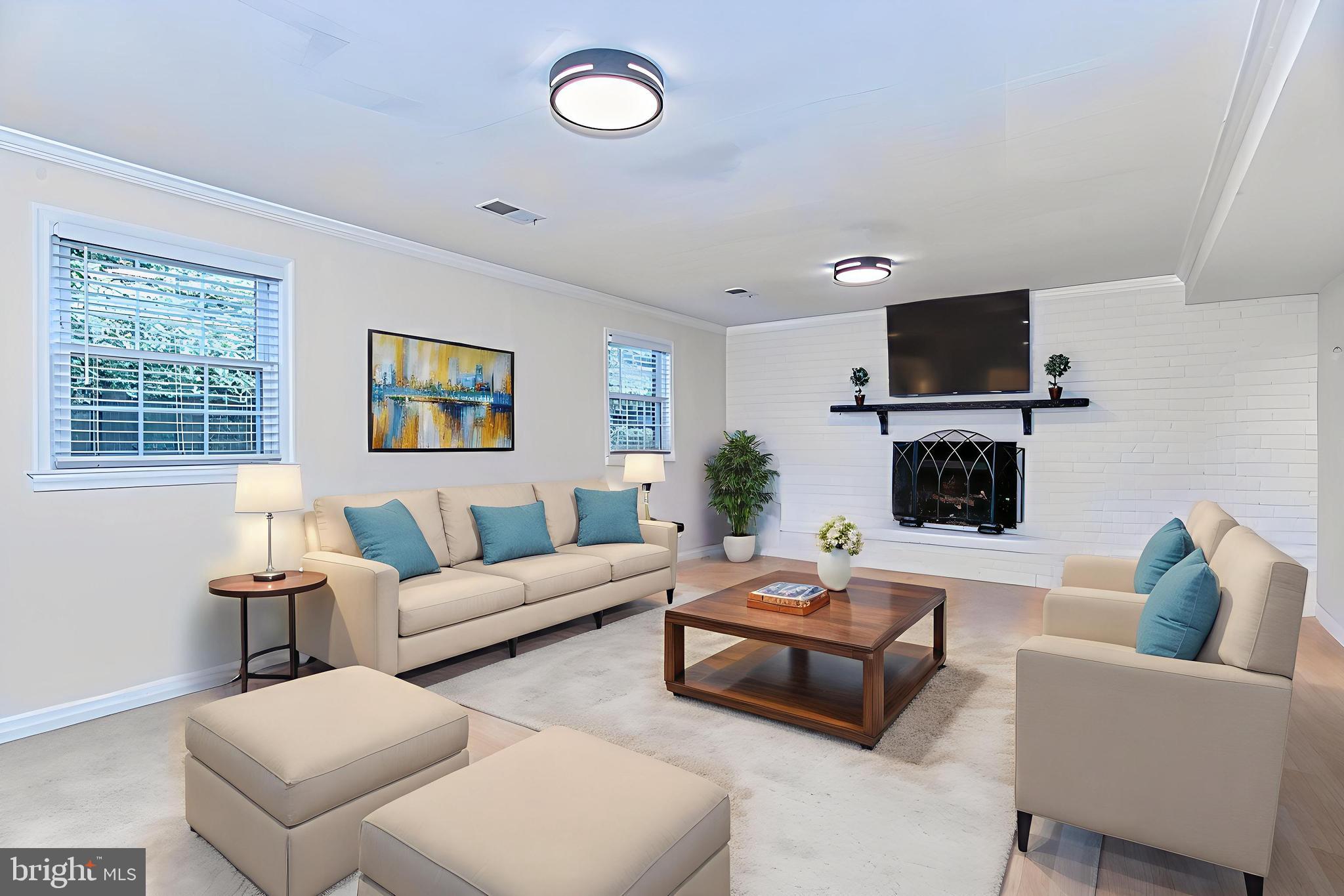 7128 Devonshire Road Alexandria, VA 22307 - Photo 4 of 36 a living room with furniture a flat screen tv and a window