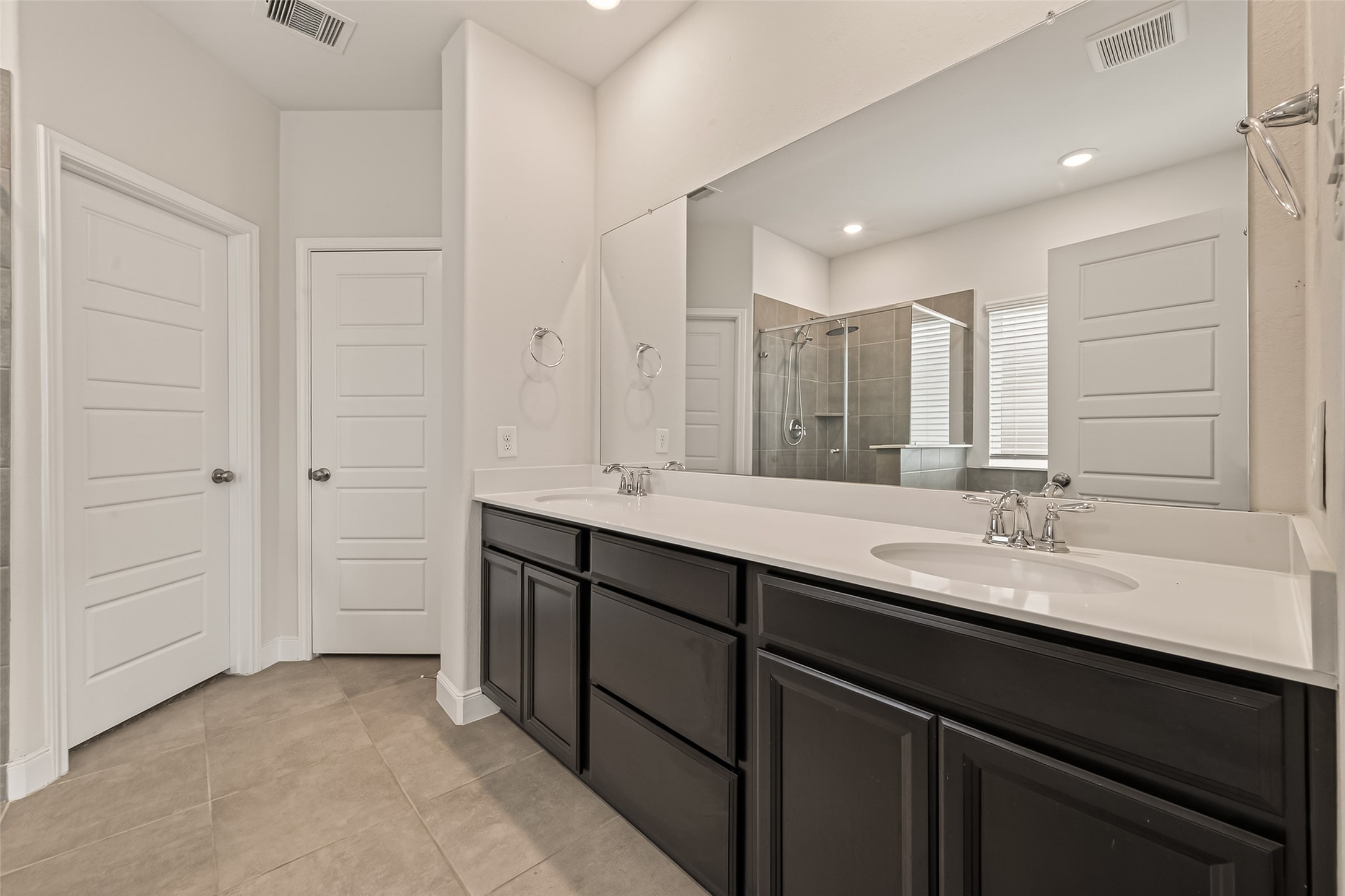 4231 Reese Ravine Lane Katy, TX 77493 - Photo 11 of 32 Primary bedroom ensuite bathroom with dual sinks and counter space.
