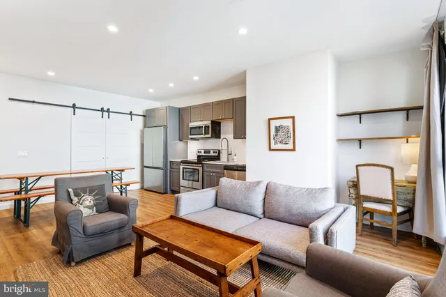 a living room with furniture and a couch