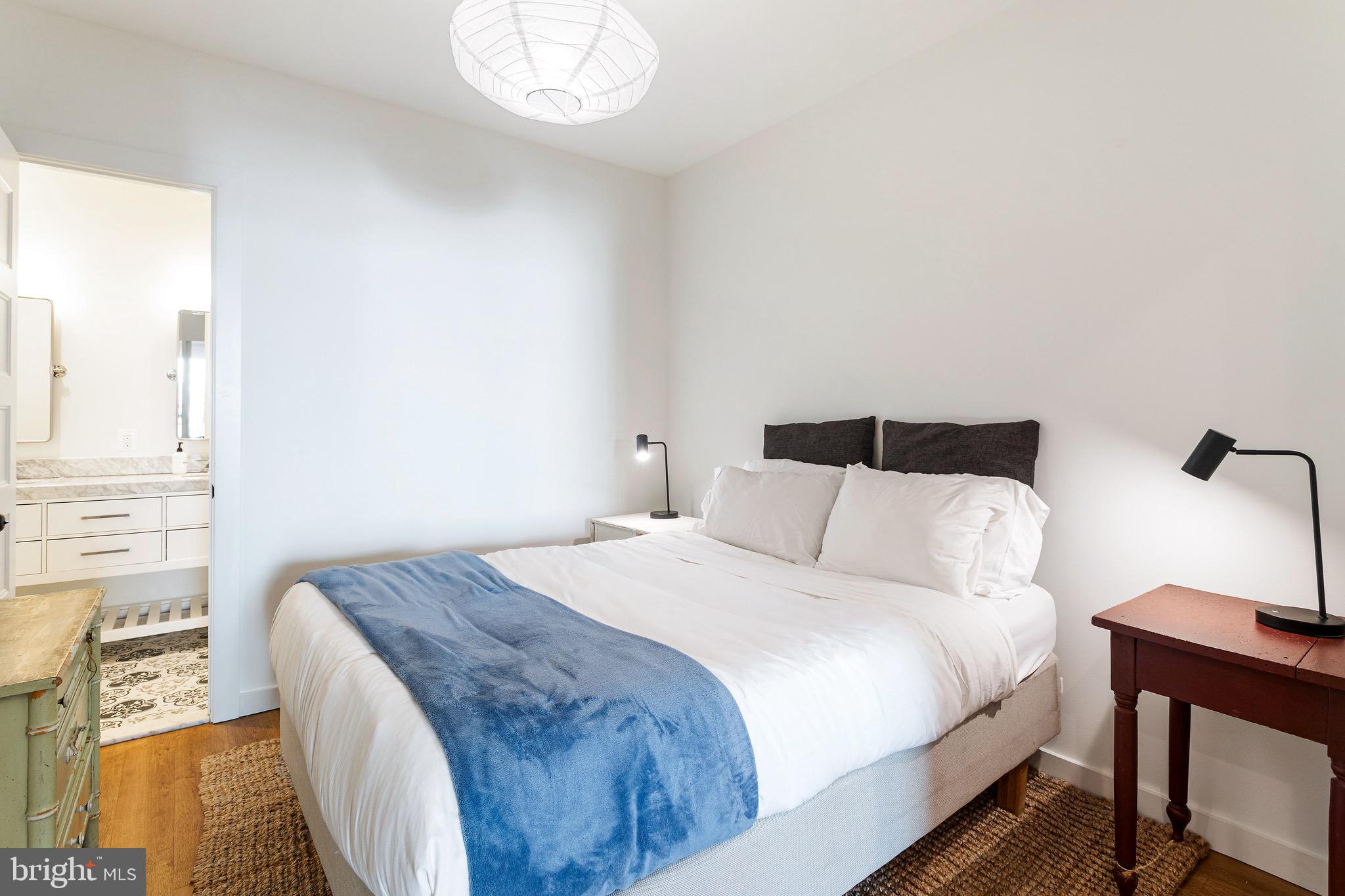 2465 18th Street Northwest, Unit 2 Washington, DC 20009 - Photo 10 of 18 a bedroom with a bed and a window